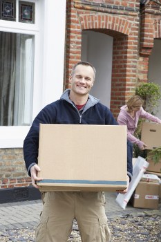 Moving team loading furniture safely with protective equipment