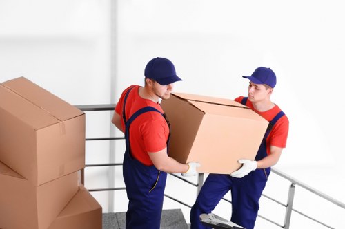Removalists loading furniture for a Waterloo home move