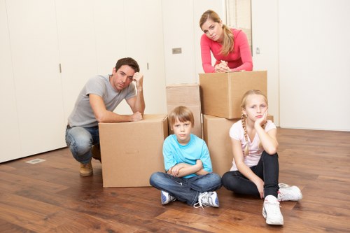 Experienced movers loading furniture into a van in Waterloo