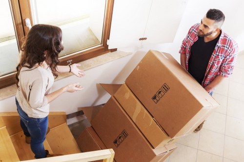 Furniture being carried through a Waterloo townhouse