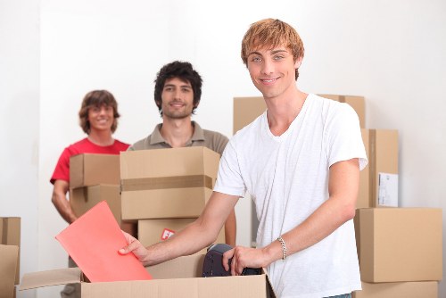 Residential movers handling furniture in a Waterloo apartment move