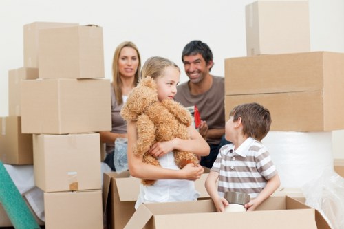 Moving team handling furniture in a Waterloo apartment building